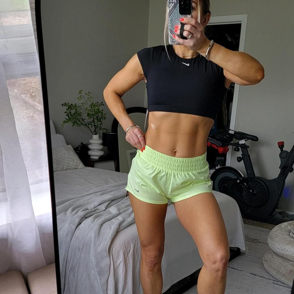 NWT NIKE women's running/training shorts in electric lime green.
